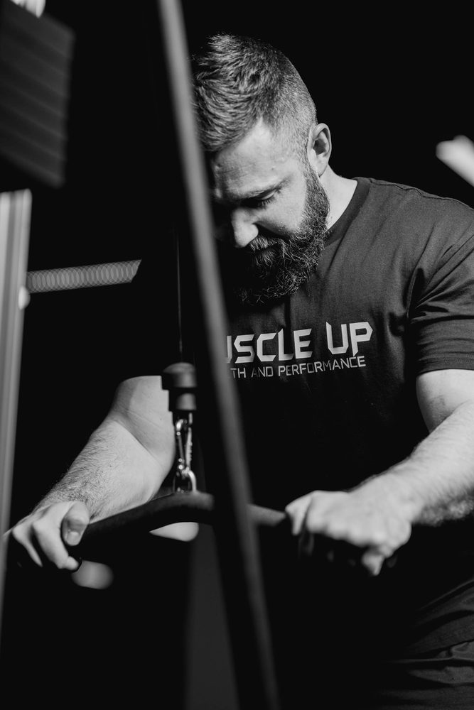 A bearded member pulling a cable attachment
